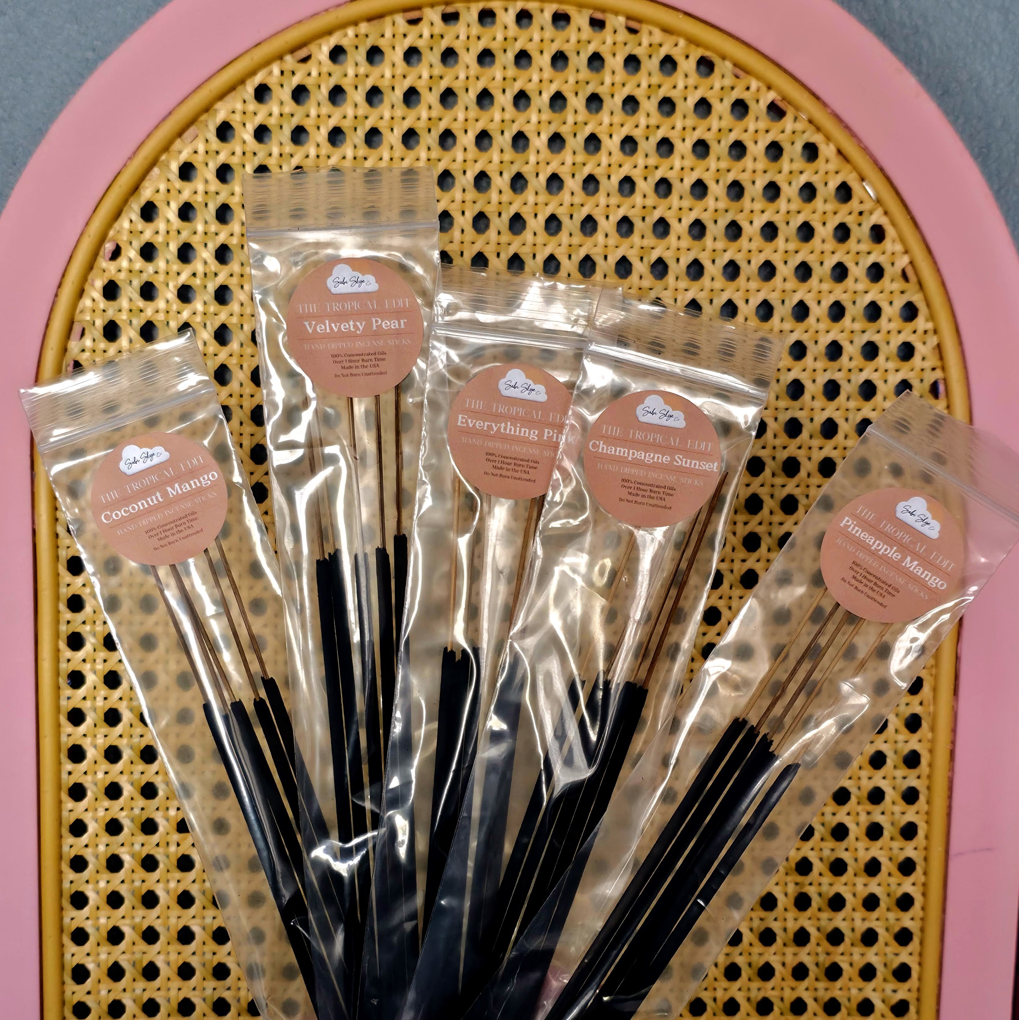 Five incense scent bundles arranged showing Pineapple Mango, Everything Pink, Velvety Pear, Coconut Mango and Champagne Sunset packaging